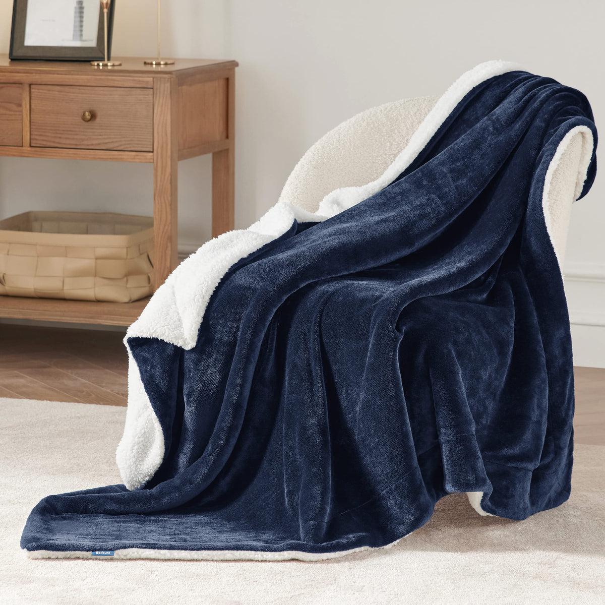 Bedsure GentleSoft Sherpa blanket draped on sofa makes a perfect couch companion.