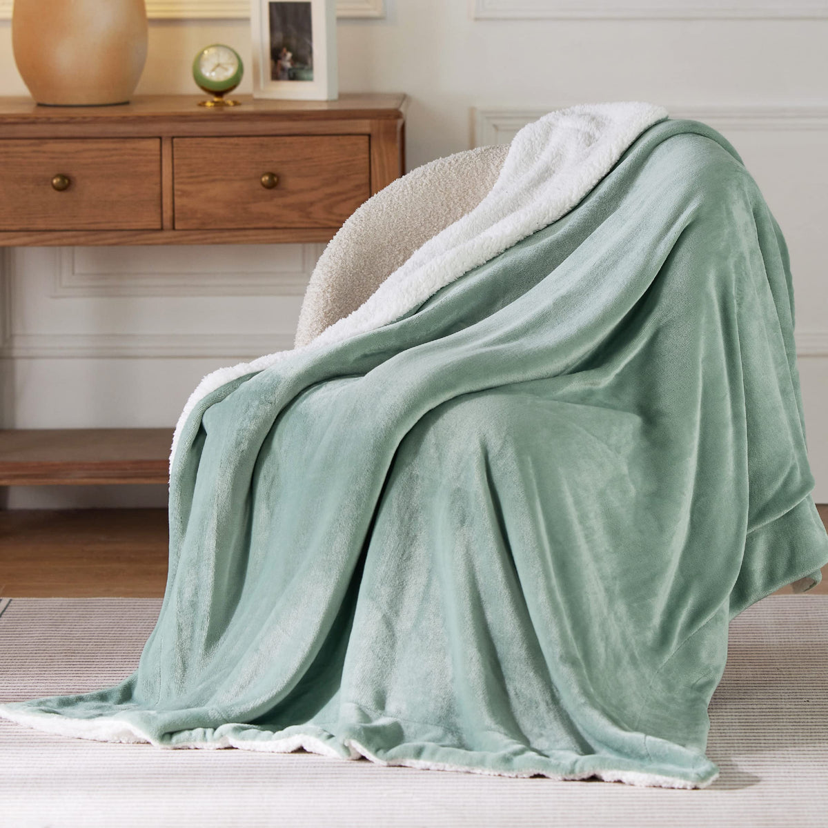 Bedsure GentleSoft sherpa blanket folded to show 50x60 size and durable stitching.