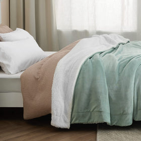 Bedsure GentleSoft sherpa blanket draped for evening relaxation on couch.
