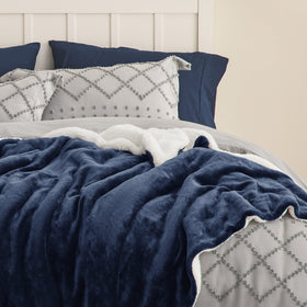 Bedsure GentleSoft Sherpa Blanket on couch invites relaxing movie nights with soft warmth