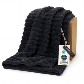 Bedsure GentleSoft twin XL blanket on a couch, plush microfiber for cozy lounging.