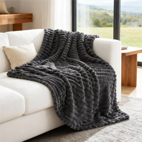 Bedsure grey fleece throw placed on bed for morning routines