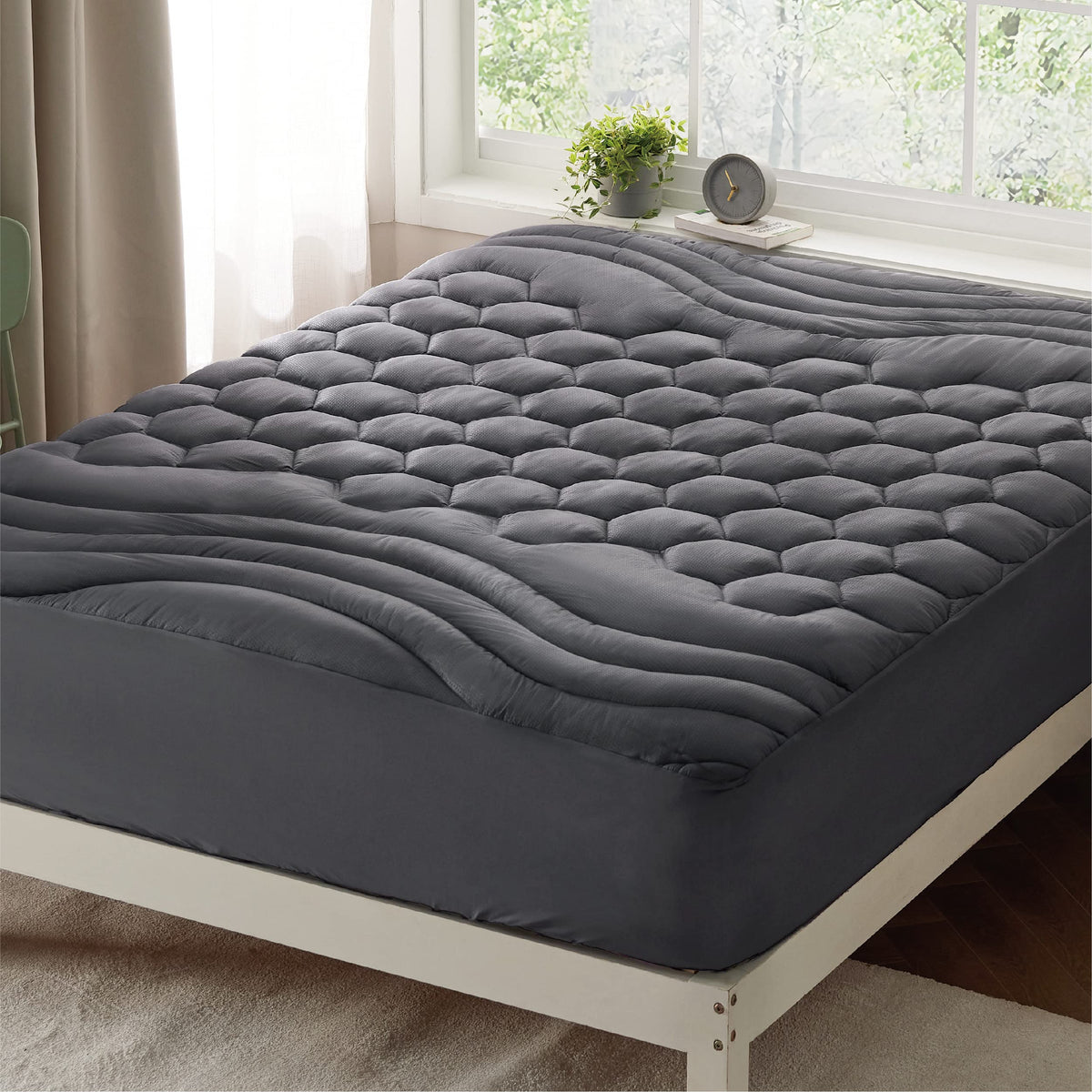 Bedsure grey queen mattress pad packaging shows product ready for setup.
