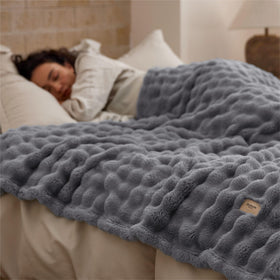 Bedsure grey throw draped on bed adds subtle texture and style.