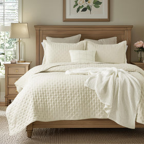 Bedsure king quilt cream close-up showing plush microfiber texture and softness