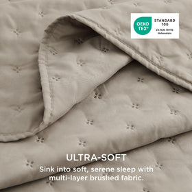 Bedsure all-season taupe quilt with 85 GSM shell and warm feel.