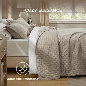 Bedsure taupe quilt with embossed Clover pattern adds depth.