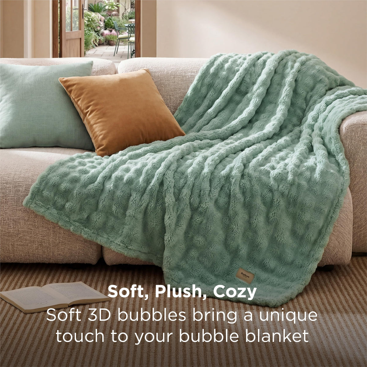 Bedsure lightweight all-seasons blanket draped on a sofa demonstrating year-round warmth