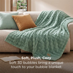 Bedsure lightweight all-seasons blanket draped on a sofa demonstrating year-round warmth