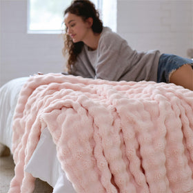 Bedsure lightweight throw blanket in pink is easy to drape for all-season use.