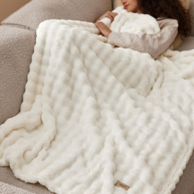 Bedsure 3D texture blanket on a bed creates inviting bedroom decor.