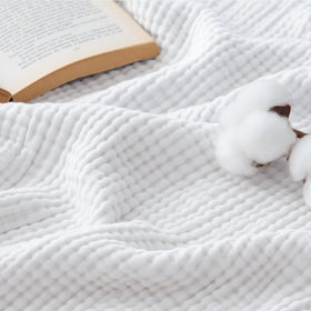 Bedsure muslin blanket with soft hand feel for comfortable lounging.