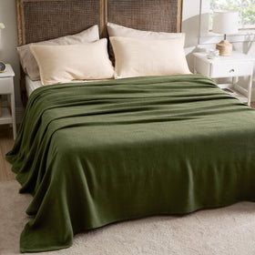 Bedsure olive green herringbone blanket adds elegant texture to rooms.