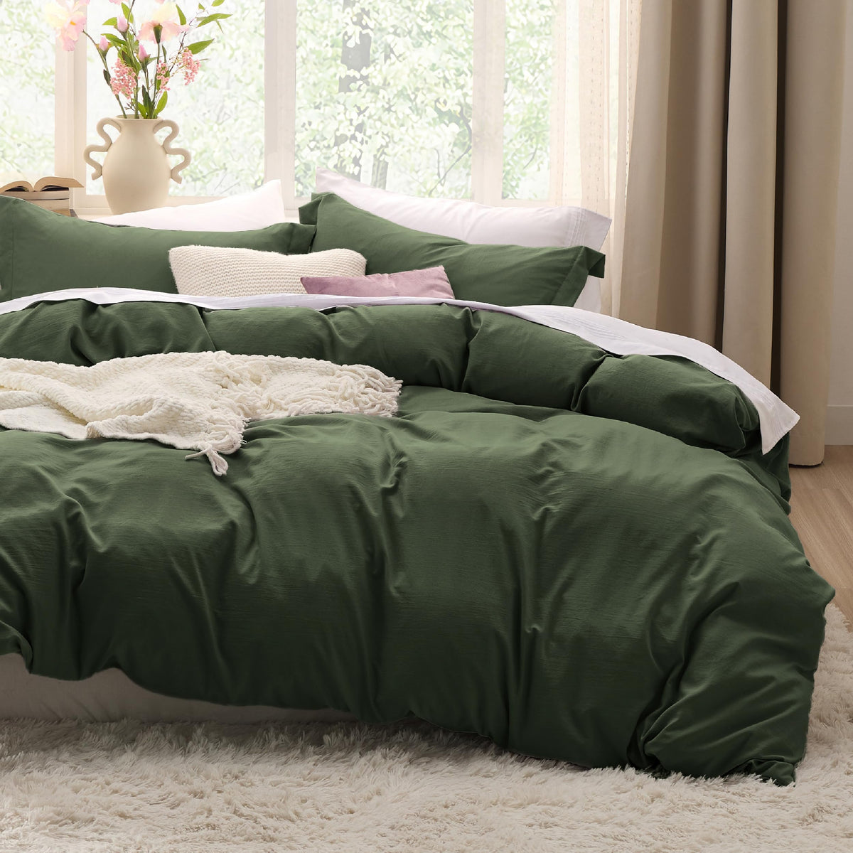 Bedsure olive green oversized king duvet cover on a well-made bed for a cohesive look.