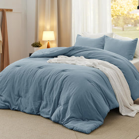 Bedsure oversized king comforter in dusty blue front view, soft and inviting for all-season warmth.