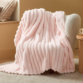 Bedsure pink throw blanket offers soft cozy warmth for lounging.
