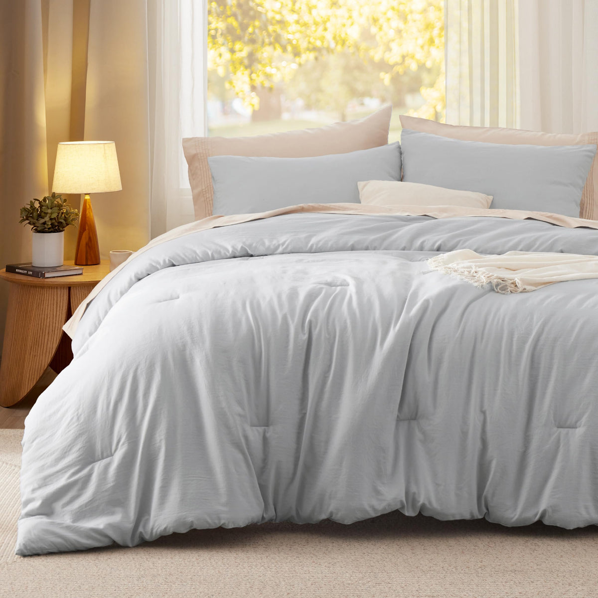Bedsure queen comforter set in light-grey showcases versatile color and all-season comfort.