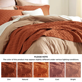 Bedsure red-orange quilt on bed adds vibrant color to room