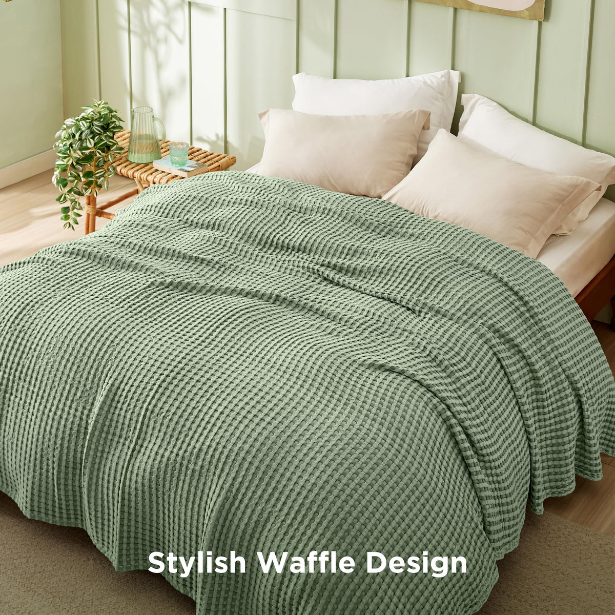 Bedsure sage-green blanket draped over a sofa, adding texture and color.