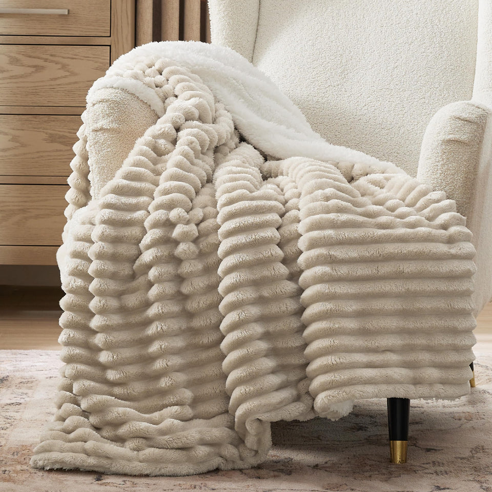 Bedsure Sherpa blanket with stripe pattern on sofa adds cozy ambiance.