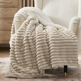 Bedsure Sherpa Throw Blanket on couch in beige for cozy living room warmth