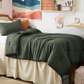 Bedsure dark green comforter on a dorm bed highlights subtle wrinkle-friendly style