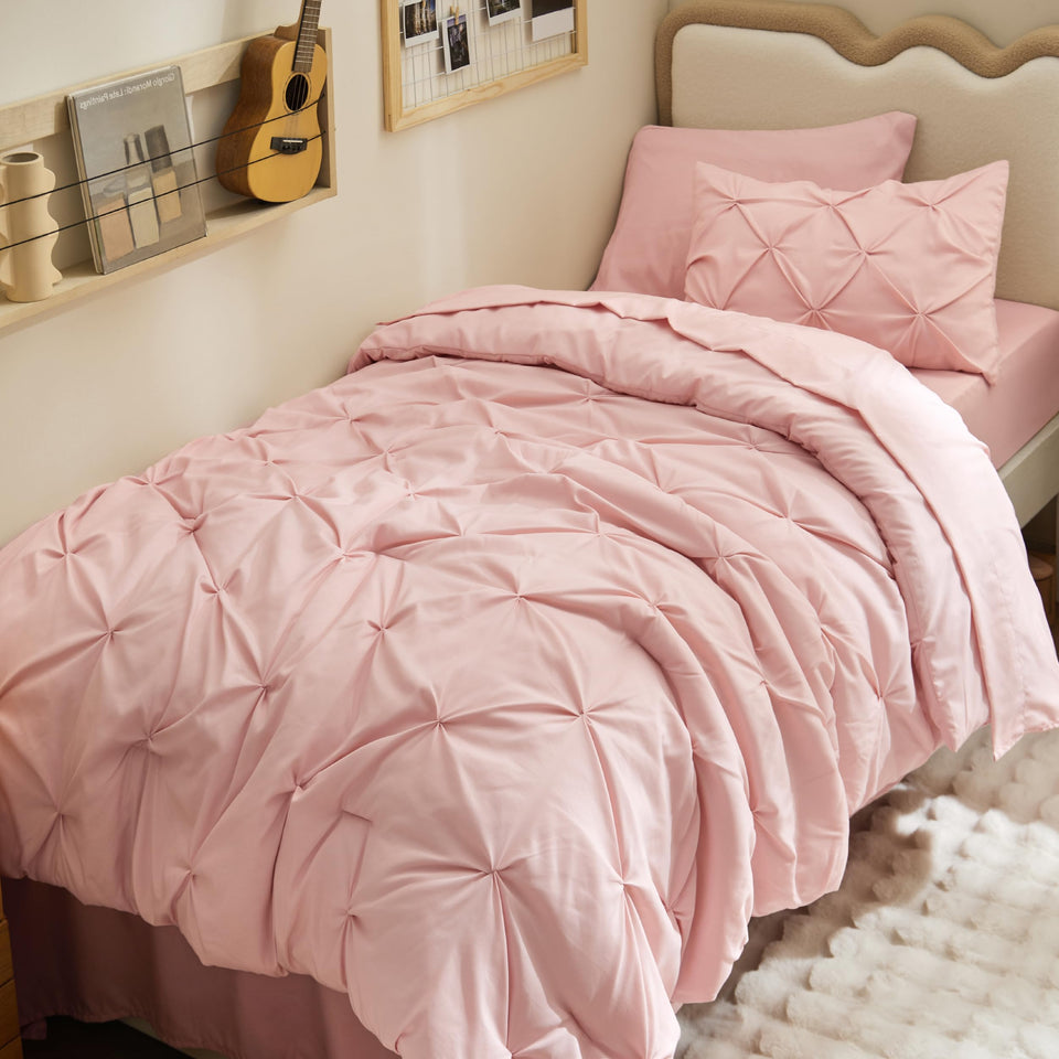 Bedsure Twin XL comforter set in pink on a dorm bed for a cozy nights sleep