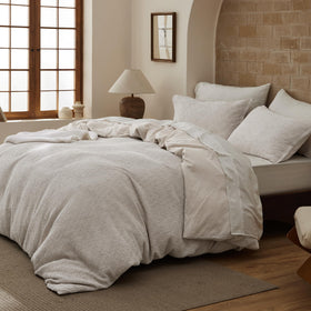 Bedsure waffle duvet in space-dyed tones adds subtle color variation to the room.