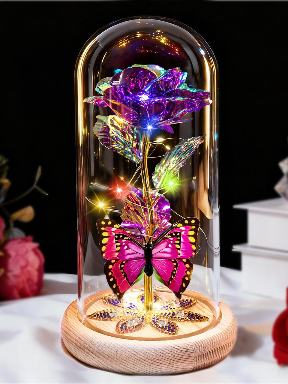 Beferr galaxy glass rose on wood base glows warmly for elegant décor.
