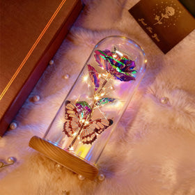 Beferr rose lamp on wood base—soft glow enhances ambience.