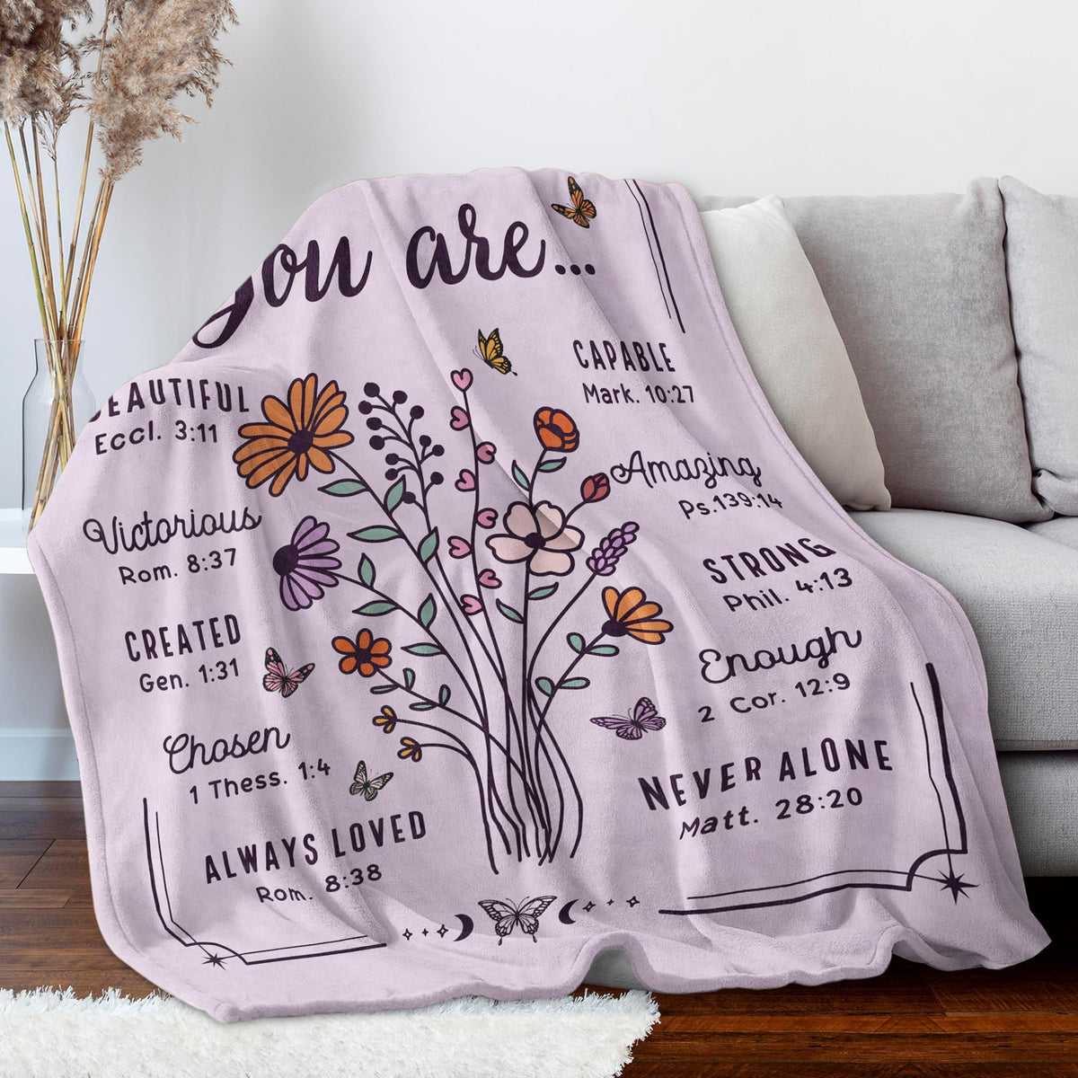 BeneCharm blanket draped on sofa creates inviting living room scene.