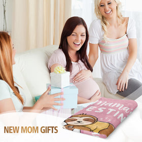 BeneCharm pink pregnancy blanket draped on a bed for relaxing moments