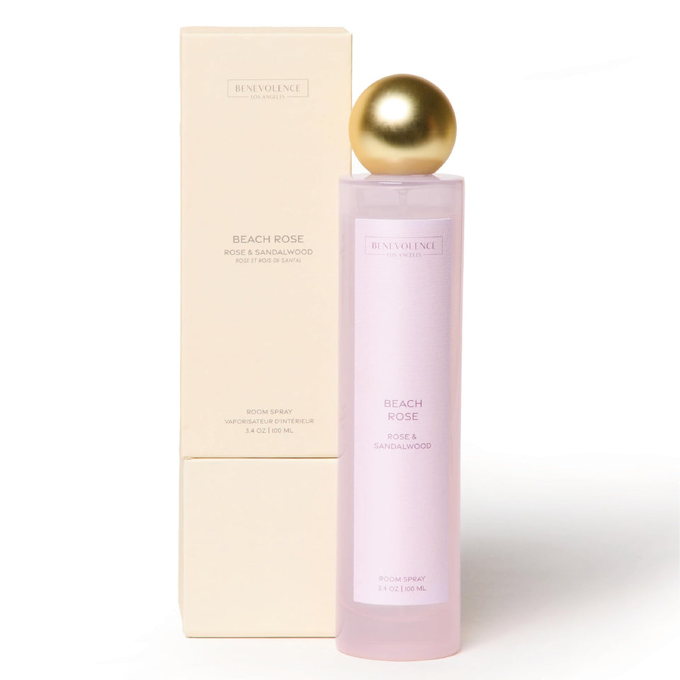 Benevolence LA Rose & Sandalwood room spray bottle releasing a balanced floral-sandalwood aroma that freshens spaces.