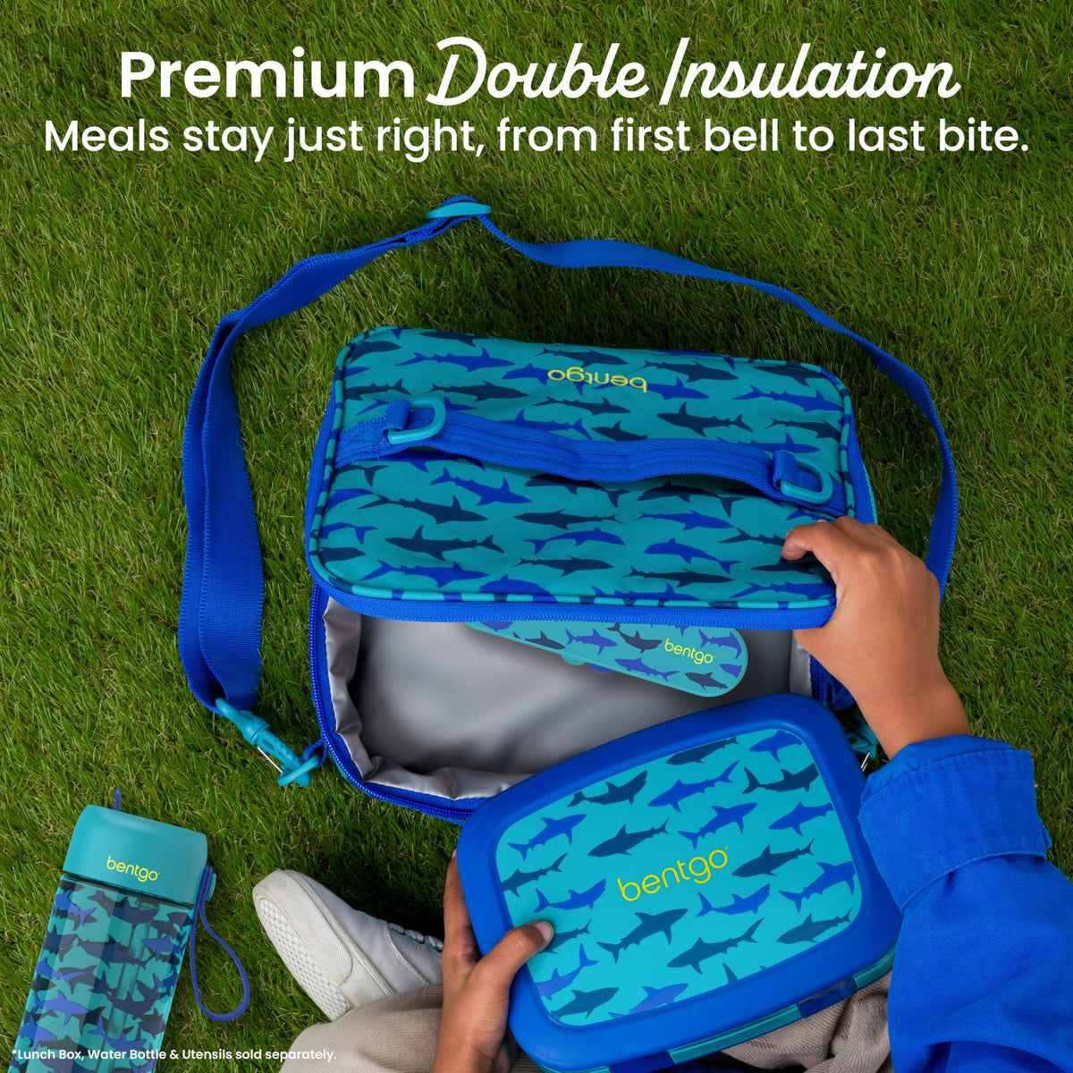 Bentgo Kids Shark buckle and D-ring attachments secure to a backpack.