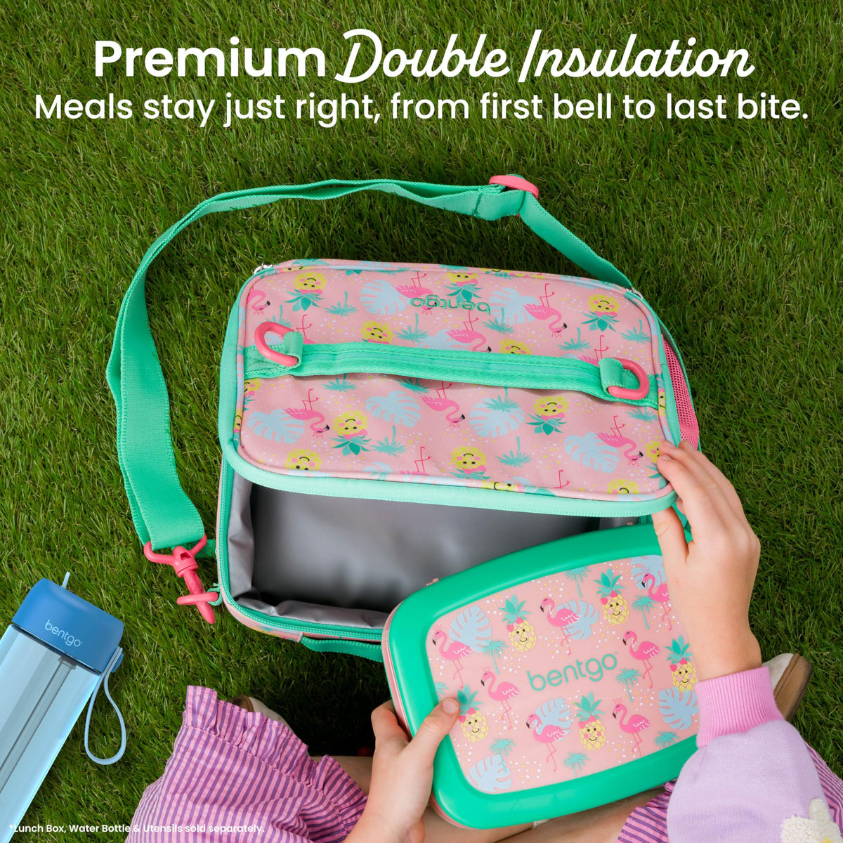 Bentgo Kids Lunch Bag tropical adjustable strap provides hands-free transport.