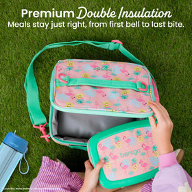 Bentgo Kids Lunch Bag tropical adjustable strap provides hands-free transport.