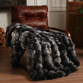 BENVWE fluffy faux fur throw blanket on couch front view