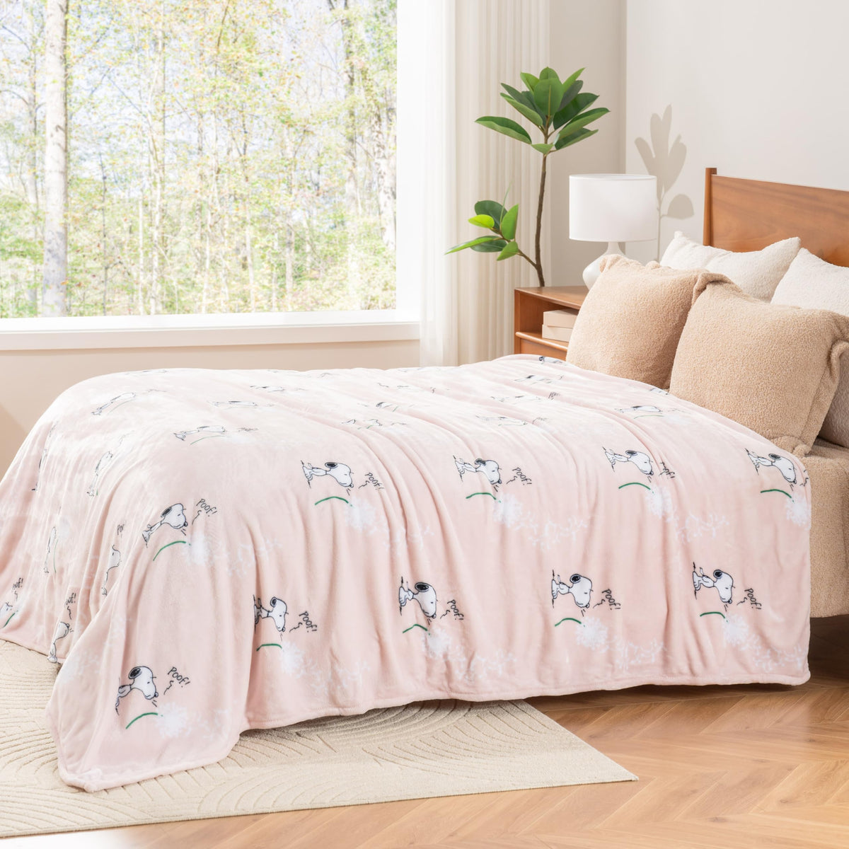 Officially licensed Peanuts blanket with Make A Wish Spring Pink color and Snoopy motif.