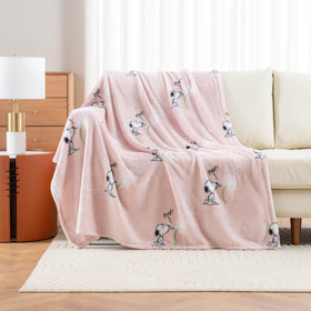 Berkshire Blanket Peanuts VelvetLoft Snoopy Make-A-Wish Pink throw close-up shows vibrant color and softness