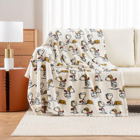 Folded Snoopy VelvetLoft throw demonstrates space-saving storage