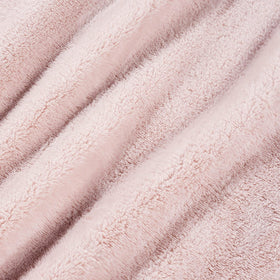Cozy lounge moment with Berkshire Blanket Primalush wearable blanket on a couch.