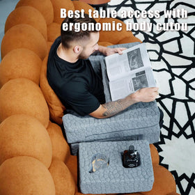 Bespilow arm-rest lap desk setup keeps cups and remotes within reach.