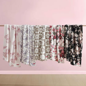 Betsey Johnson blanket cozy couch scene highlights relaxed evenings on the couch.