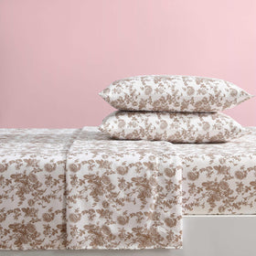 Betsey Johnson queen bed sheets in a cozy bedroom setup with warm color tones.