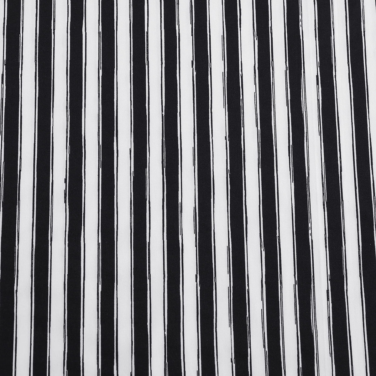 Betsey Johnson Sketchy Stripe design adds playful charm to a modern bedroom.