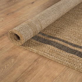Beverly Rug Easy Jute Border Rug 5x7 shown behind sofa with rug durability.
