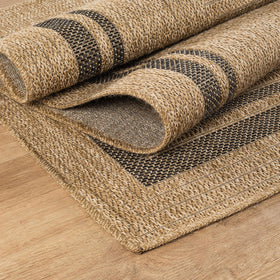 Beverly Rug Easy Jute Border Rug 5x7 in a living room setup with soft texture.
