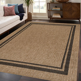 Beverly Rug Easy Jute Border Rug 5x7 on patio for casual outdoor use.