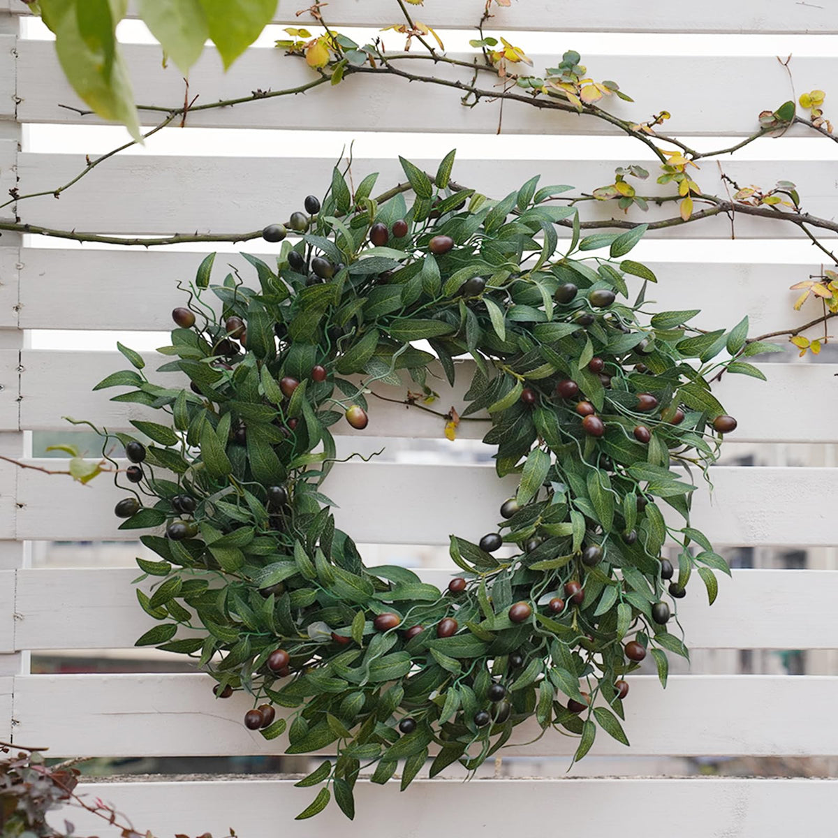 BHHDA Olive Wreath shown on door with hanging loop for easy display.