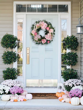 Bibelot pink rose wreath suitable for indoor or covered outdoor use.